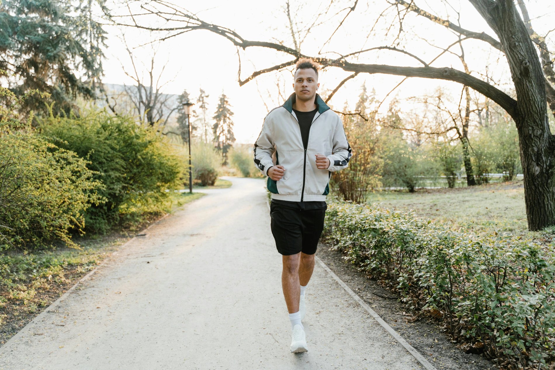 Man jogging at sunrise for heart disease prevention through daily exercise